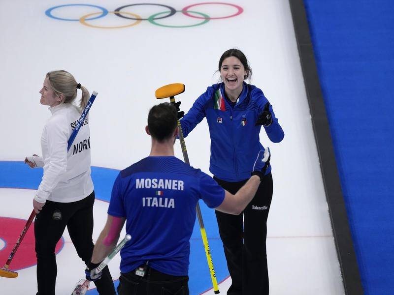 Stefania Constantini and teammate Amos Mosaner after winning the mixed doubles curling gold medal
