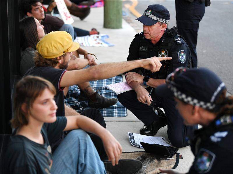 Police are negotiating with protesters at a Brisbane hotel where asylum seekers are detained.