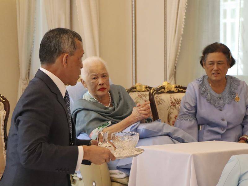 Thailand's Queen Sirikit, 86, (centre) has been admitted to hospital with influenza.