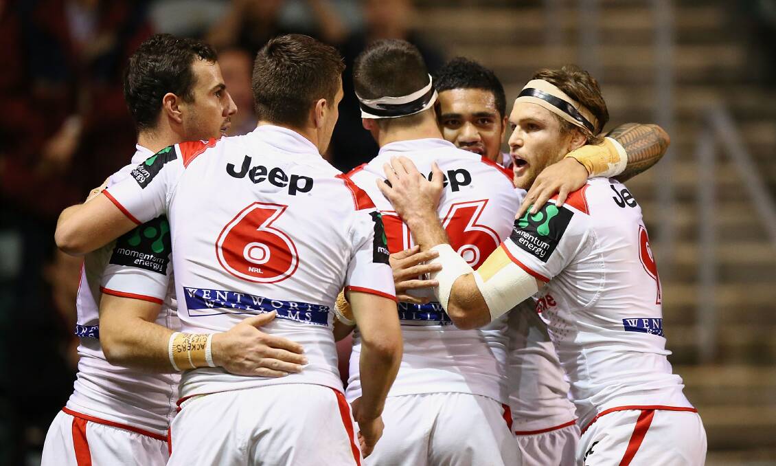 The Dragons celebrate a Peter Mata'utia try during their round-24 snoozefest against the Panthers at WIN Stadium. Picture: GETTY IMAGES