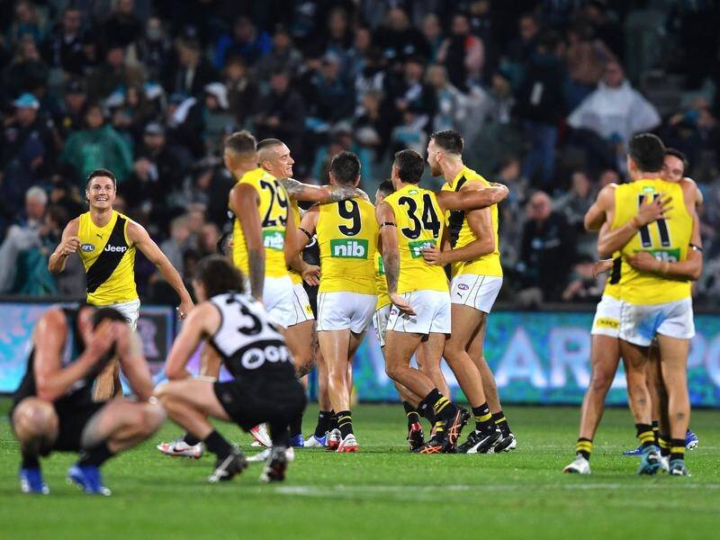 Richmond celebrate their win over Port Adelaide as they advance to another AFL grand final.