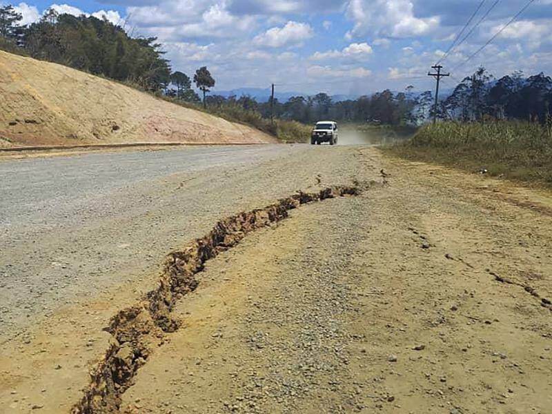PNG residents have posted images to social media of cracked roads, along with damaged buildings. (AP PHOTO)