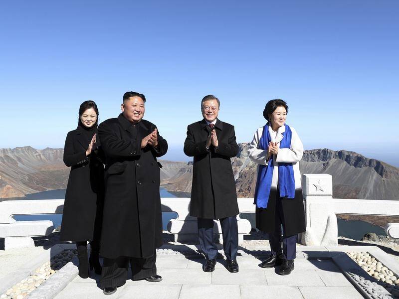 The leaders of the two Koreas have visited the summit of a sacred mountain in North Korea.