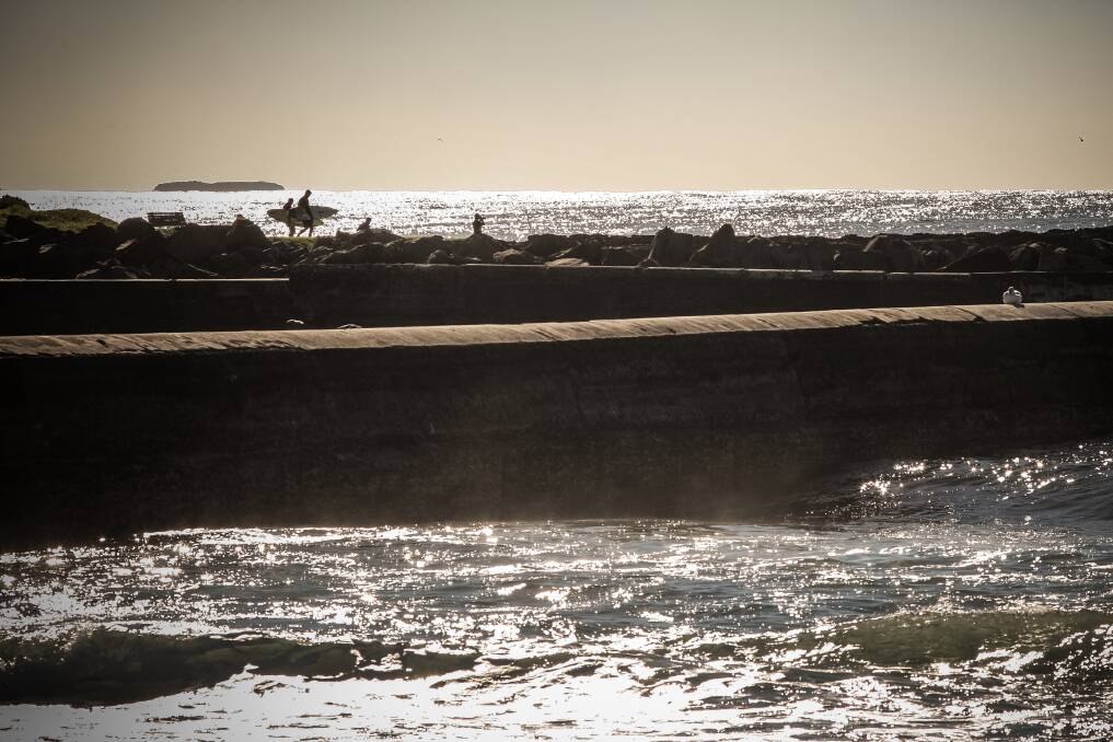 Surfers enjoy the fine mid-winter weather spell. Picture: ADAM McLEAN