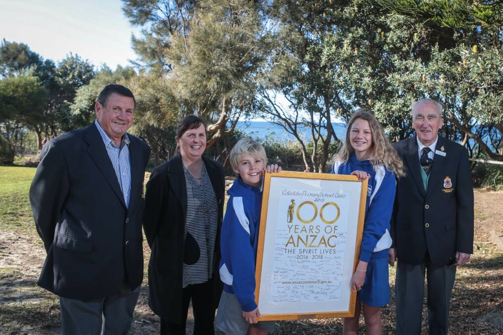 Coledale RSL secretary Warwick Wenham, Coledale Public School principal Tanya Potter, school captains Kylan Van Anen and Lilly Sellers and Coledale RSL president Jim Bates with the poster. Picture: ADAM McLEAN