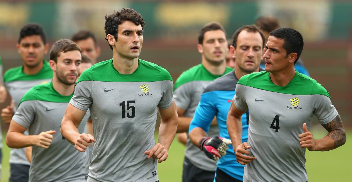 Socceroos captain Mile Jedinak and Tim Cahill warm up with teammates in Vitoria on Thursday. Picture: GETTY IMAGES