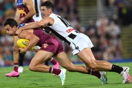A new interpretation to the holding-the-ball rule will come into effect in round 12. (Darren England/AAP PHOTOS)