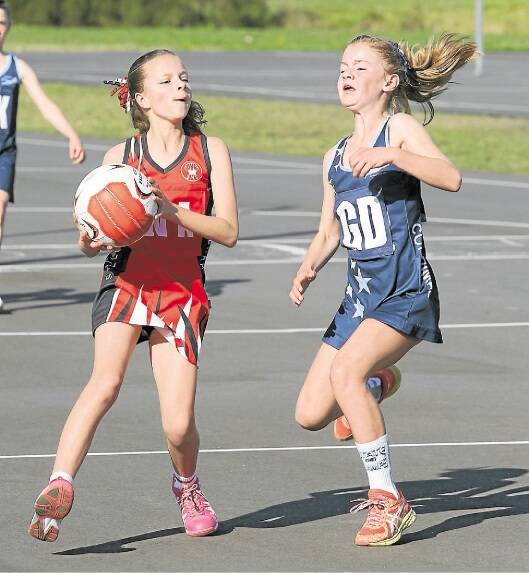 Shellharbour's Dakota Hutchinson (left) and Corrimal's Gabby Eaton show their games faces in the 10a grand final.