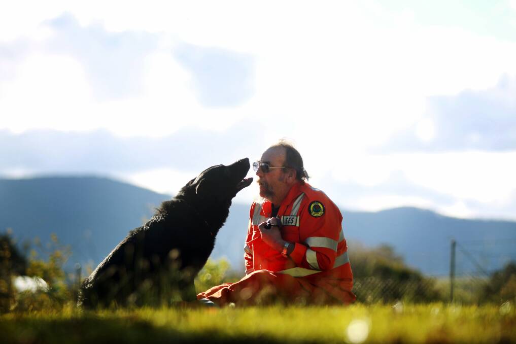 Instructor Dirk Littooy has been training seven-year-old Raffles to assist in SES rescue operations. Picture: SYLVIA LIBER