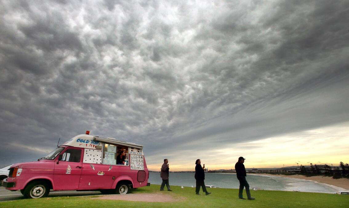Cassandra Descalzo, in her ice-cream truck on Flagstaff Hill, watches as the cold front moves over the region. Picture: KIRK GILMOUR