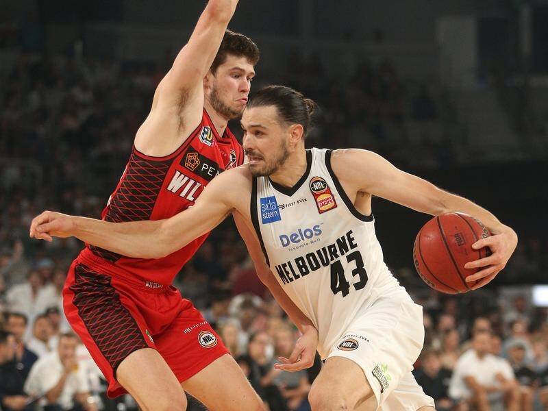 Chris Goulding (right) top scored for Melbourne in their NBL rout of Perth.
