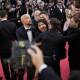 Woman stages semi-naked protest at Aussie director George Miller's premiere at Cannes Film Festival.