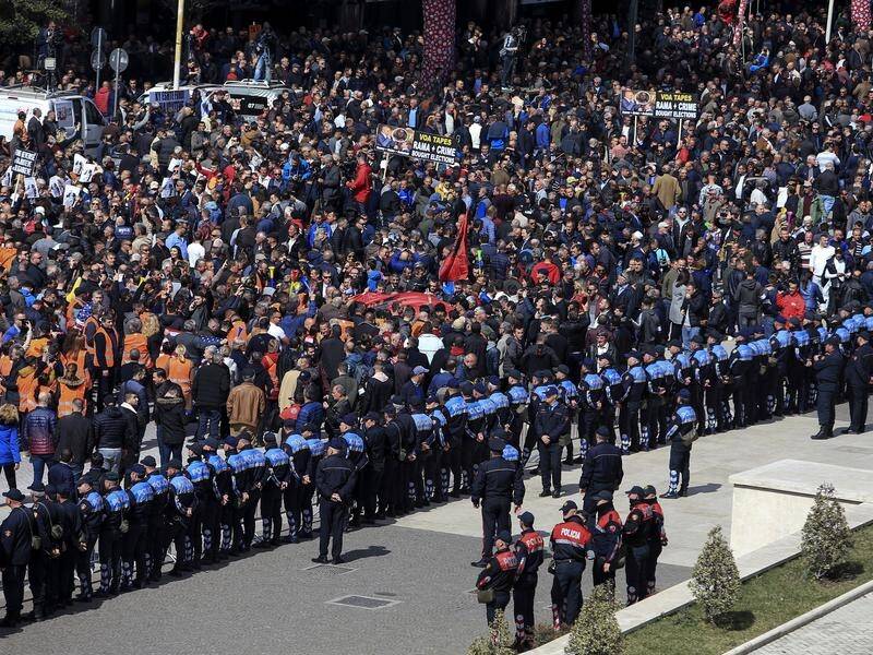 Protesters gather at the Prime Minister's office during an anti-government rally in Tirana, Albania.