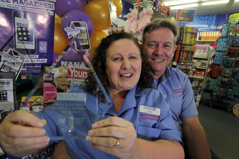 Jane and Brian Woods from Brownsville Newsagency with another trophy. They won one last year too. Picture: SYLVIA LIBER