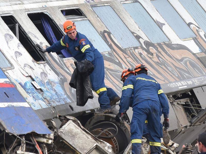 "Instead of saving lives we have to recover bodies," a rescuer said at the scene of the train crash. (EPA PHOTO)
