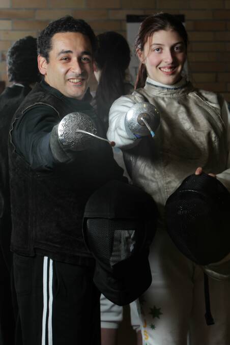 Pointy end: Fencing coach Arash Karpour and Courtney Buchanan, who is representing Australia in South Africa. Picture: GREG TOTMAN