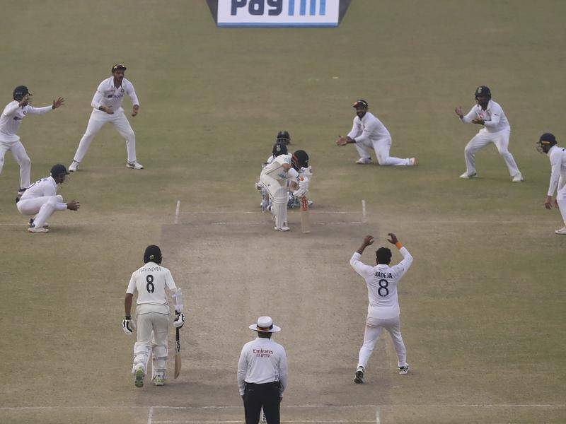 New Zealand have drawn the opening Test against India after a tense final session of play in Kanpur.