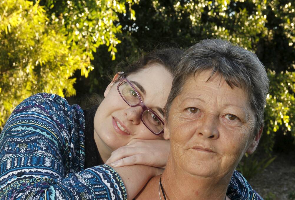 UOW student Mellissa Thompson with her mum, Fran, who is wearing her daughter's Roger Pen. Picture: ANDY ZAKELI