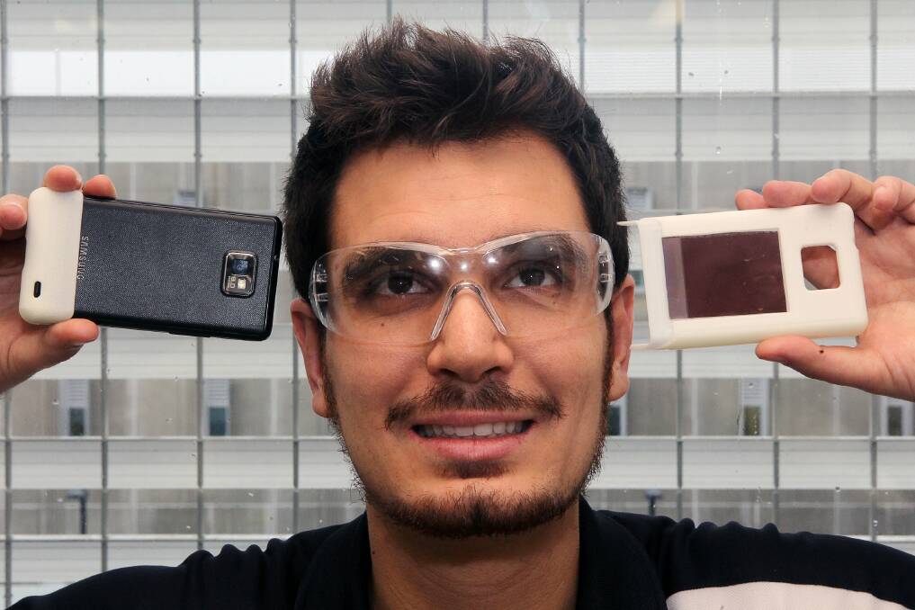 Joseph Giorgio, a student at the University of Wollongong, is working on a new type of solar panel made from low-cost material. Picture: GREG TOTMAN