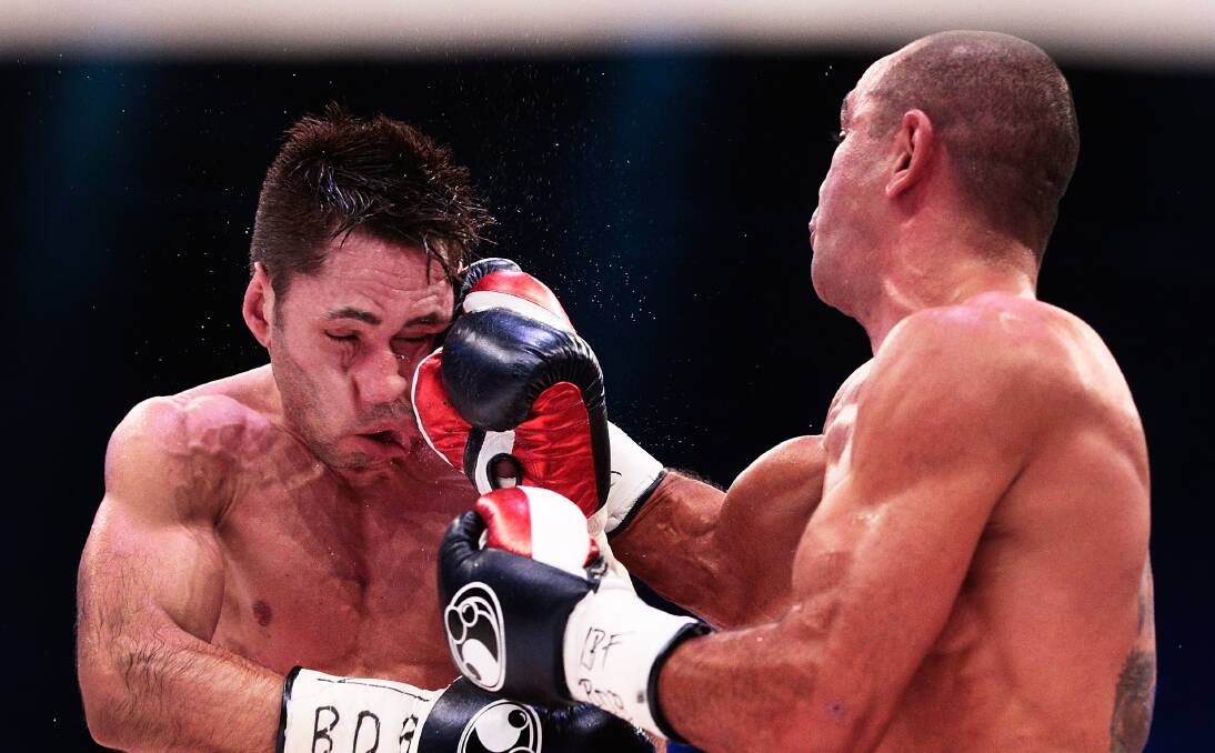 Sam Soliman takes it to Felix Sturm in Germany. Soliman won on a unanimous points decision. Picture: GETTY IMAGES