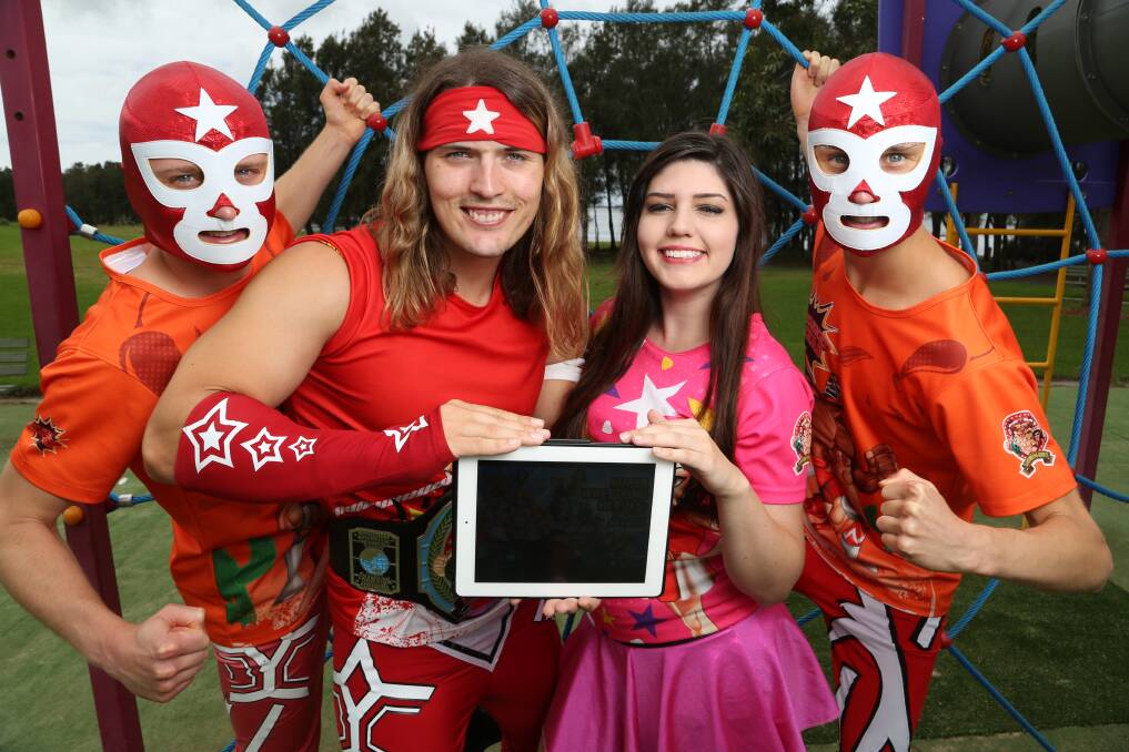 Innovation: The Masked Luchas Jason Novak, left, and Jamie Novak, right, with Benny Coles and Mighty Mel as they show off the new Super Wrestling Heroes app for youngsters to enjoy.Picture: GREG ELLIS