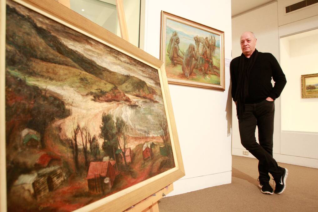 President of Wollongong Art Gallery Friends society Alan Samways with some of Margaret Olley's paintings that feature in a tribute to her talent. Picture: CHRISTOPHER CHAN