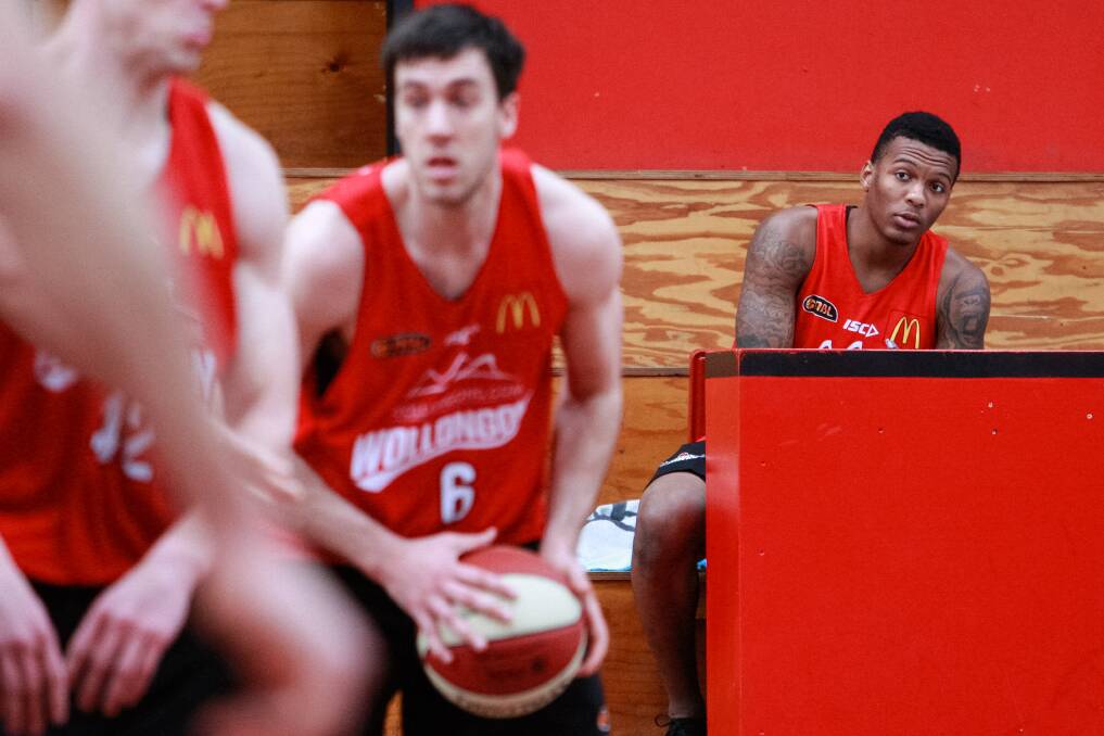 Injured import Jahii Carson is forced to watch on as his Hawks teammates practise. Picture: CHRISTOPHER CHAN