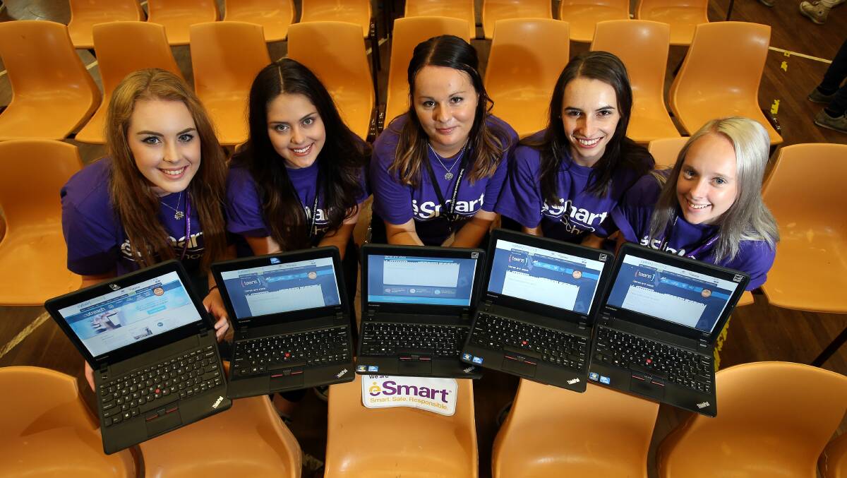 Alert: Bree Jarvis, left, Jessica Watson, Olivia Tickle, Sheridan Thomas and Brooke Bailey are staging a cyber bullying expo in the Warilla High School hall to open dialogue with students about the damage of the online bullying epidemic.Picture: KIRK GILMOUR
