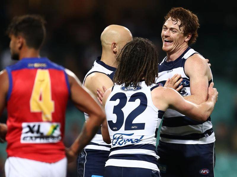 Geelong forward Gary Rohan (r) avoided suspension after being cited for incidents against Brisbane.