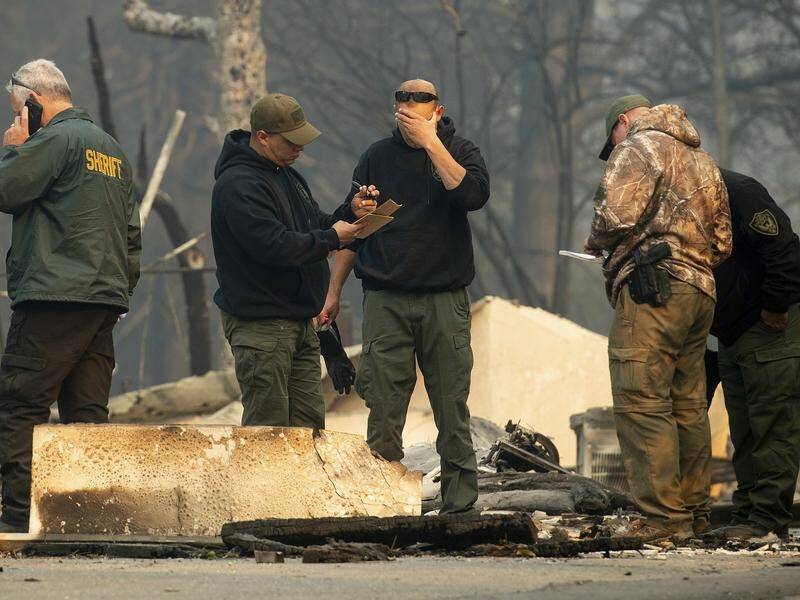 Sheriff's deputies recover the remains of Camp Fire victims in Paradise, California.