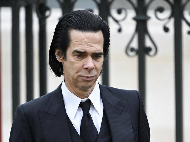 Australian singer-songwriter Nick Cave enters Westminster Abbey to attend the King's coronation. (AP PHOTO)