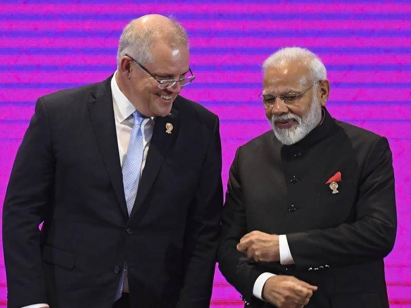 Scott Morrison (left) was set to visit India and Japan for talks to focus on regional security.