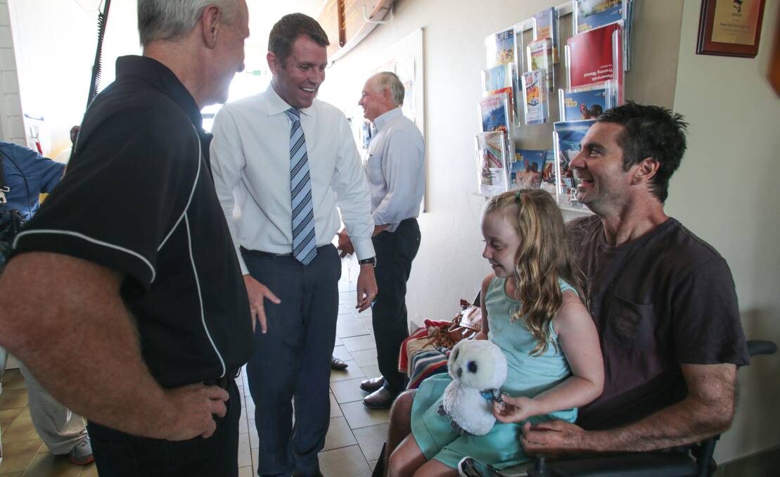 All smiles: Darren Longbottom and daughter Bowie, 7, with Premier Mike Baird. Picture: ADAM McLEAN
