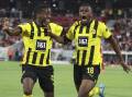 Jamie Bynoe-Gittens (l) and Youssoufa Moukoko (r) each scored as Borussia Dortmund beat Freiburg. (AP PHOTO)