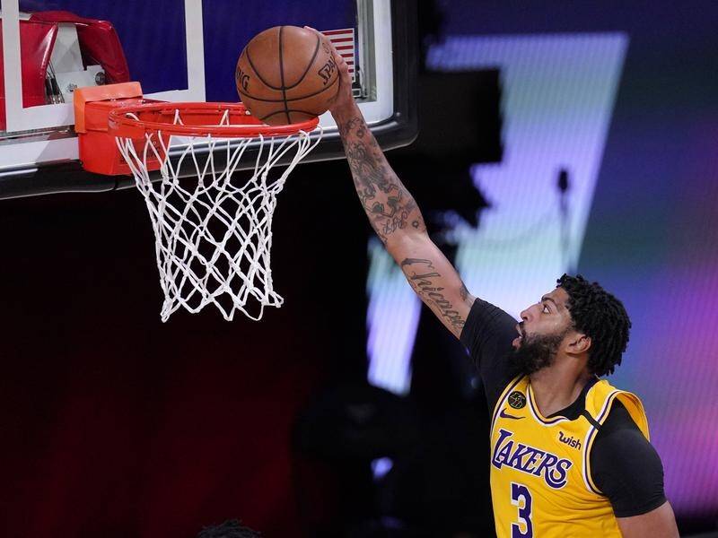LA Lakers' Anthony Davis dunks the ball in Thursday's 110-100 Game 4 win over the Houston Rockets.