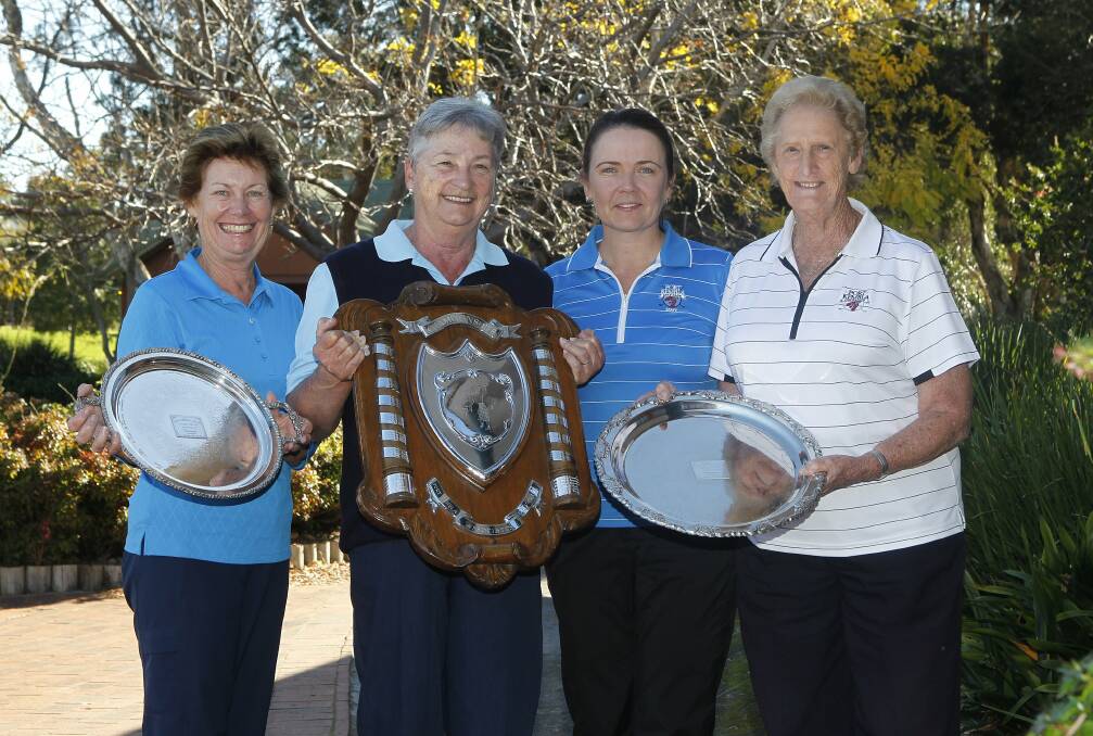 Port Kembla club championship winners Narelle Wilson, Lauris Kentwell, golf pro Cherie Alison and Pat Kelly with their trophies. Picture: ANDY ZAKELI