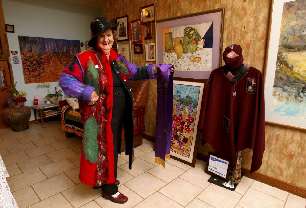 Child of paradise: Woonona artist Daisy Huckel with some of her creations.Picture: KIRK GILMOUR
