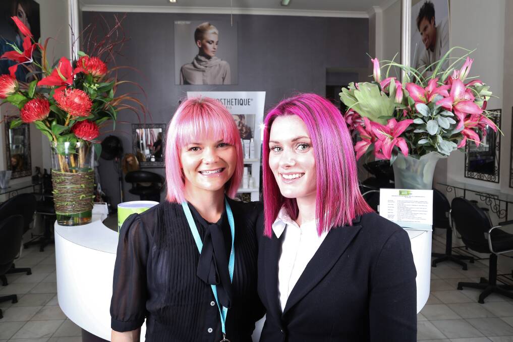 Highlights for hope: Emily Squires and Chantelle Drolc with their new pink hair. Picture: GREG ELLIS