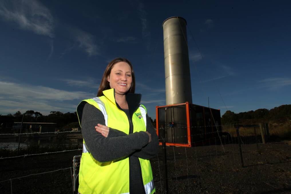 Waste management team leader from Shellharbour Council, Courtney Williams, with the methane gas flare at Dunmore waste landfill site. The flare was introduced by the council to minimise the tax. Picture: GREG TOTMAN
