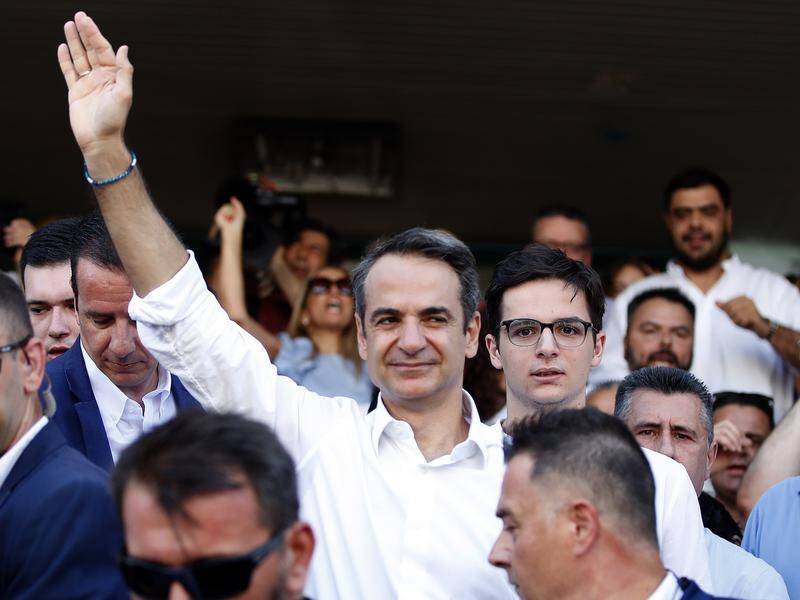 New Democracy leader Kyriakos Mitsotakis (C) had been ahead in opinion polls for three years.