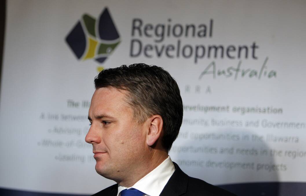 Assistant Minister for Infrastructure and Regional Development Jamie Briggs accepts Regional Development Australia's report, Transition Illawarra. Picture: ANDY ZAKELI