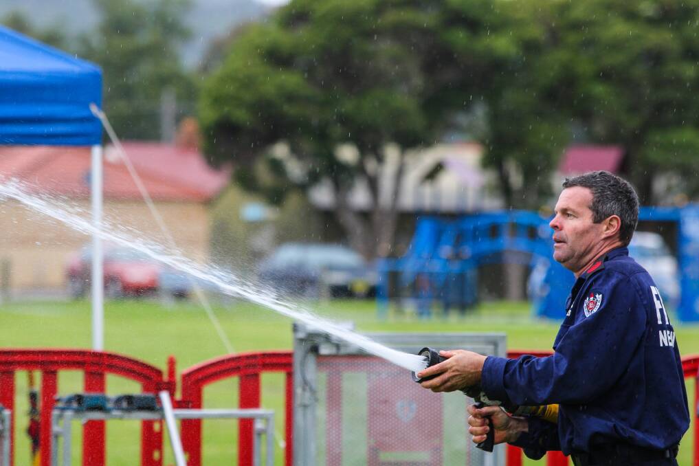 Firefighters from across NSW display all their skills in round two of their championships at Unanderra. Picture: ADAM McLEAN