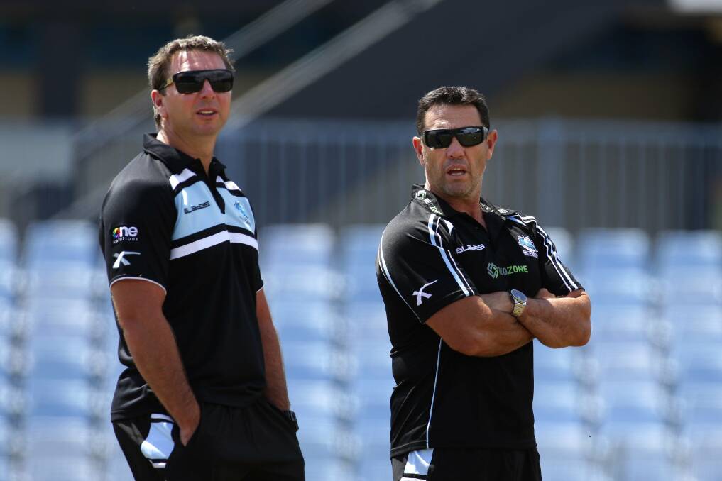 Different attitude: Sharks coach Shane Flanagan (right) and new assistant Steve Price at training. Picture: JOHN VEAGE