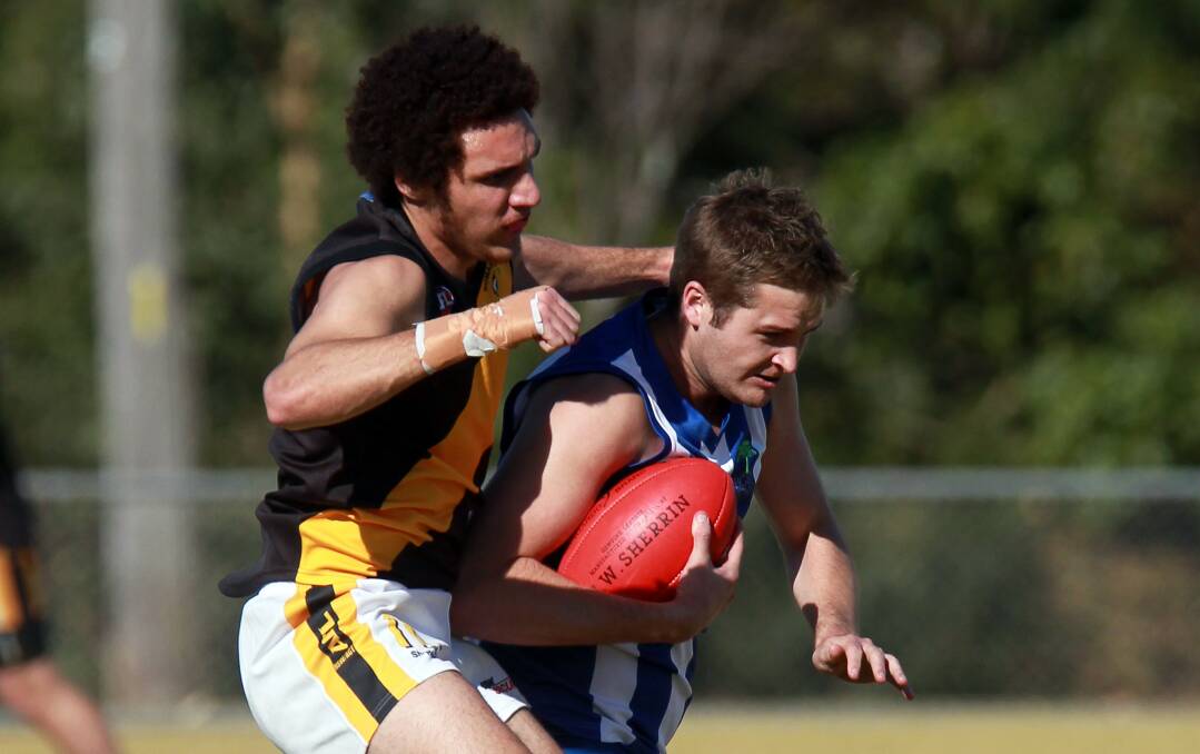 Figtree's Cameron Hart looks to break Liam Arnold of Bomaderry's tackle in last Saturday's match. Bomaderry have the final round bye, while Figtree travel to West Street Oval to take on Nowra. Picture: SYLVIA LIBER