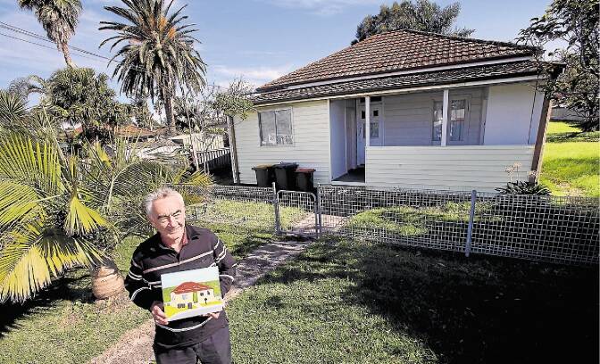 Frank Nowlan in front of a house he painted in Arthur St Thirroul. PICTURE: KIRK GILMOUR