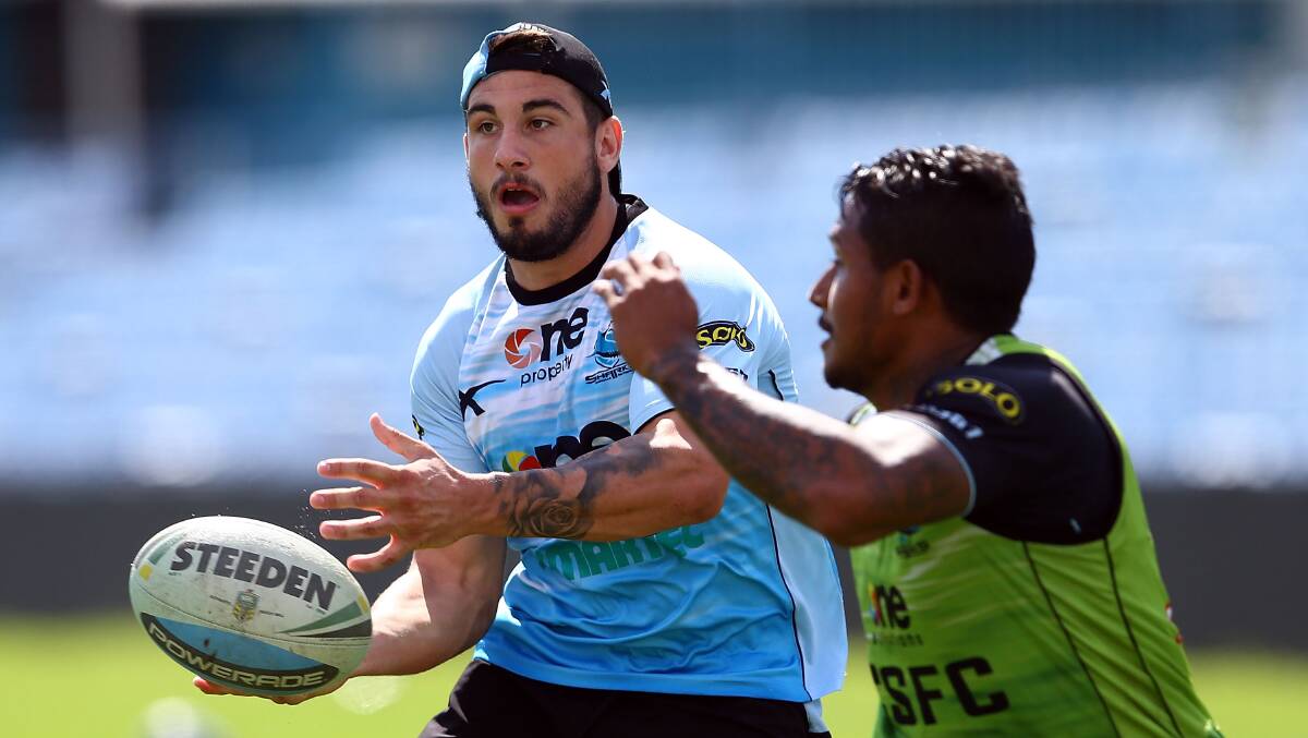 With Ben Barba closing in, Jack Bird gets a pass away during a Sharks training session. Picture: GETTY IMAGES