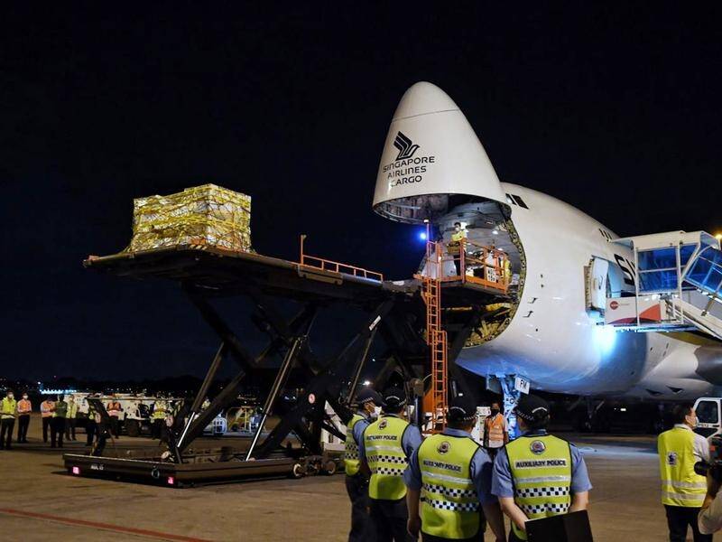 The first shipment of Covid-19 vaccines for Singapore being unloaded at Changi Airport.