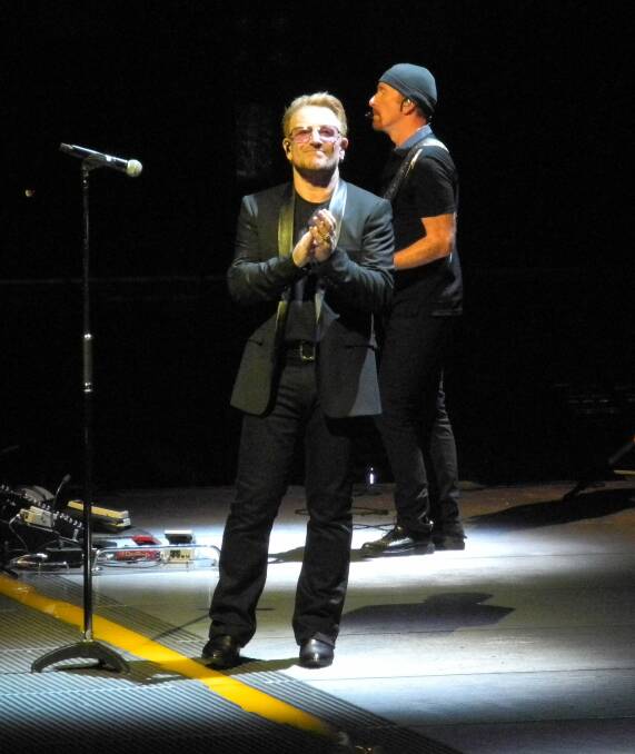U2's lead singer Bono, shows his appreciation applauding the fans during the third concert of eight played at New York City's Madison Square Garden during the 2015  iNNOCENCE + eXPERIENCE tour. Picture: KIRK GILMOUR