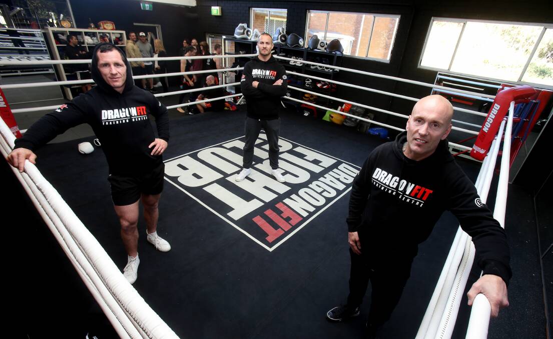Josh Miller, Matt Cooper and trainer Brett Harriott at DragonFit Fight Club gym in North Wollongong. Picture: ROBERT PEET