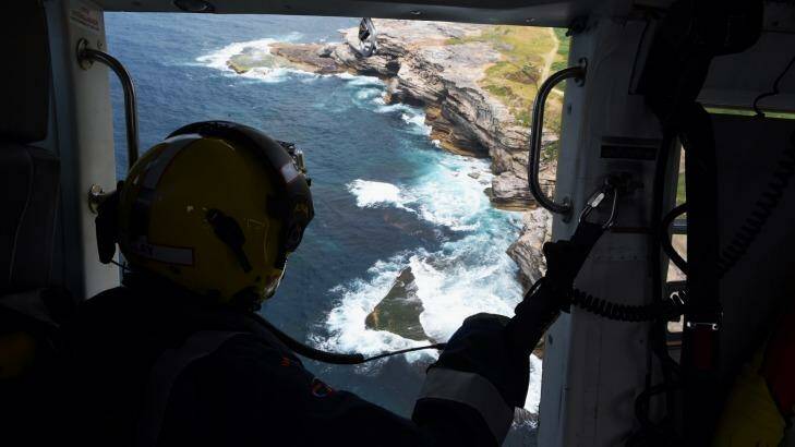 The surf rescue helicopter is often busiest on days when the ocean is deceptively calm. Photo: Nick Moir
